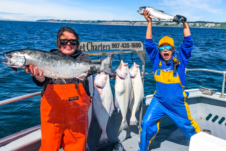 Girl holding fish she caught