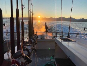 a boat is docked next to a body of water