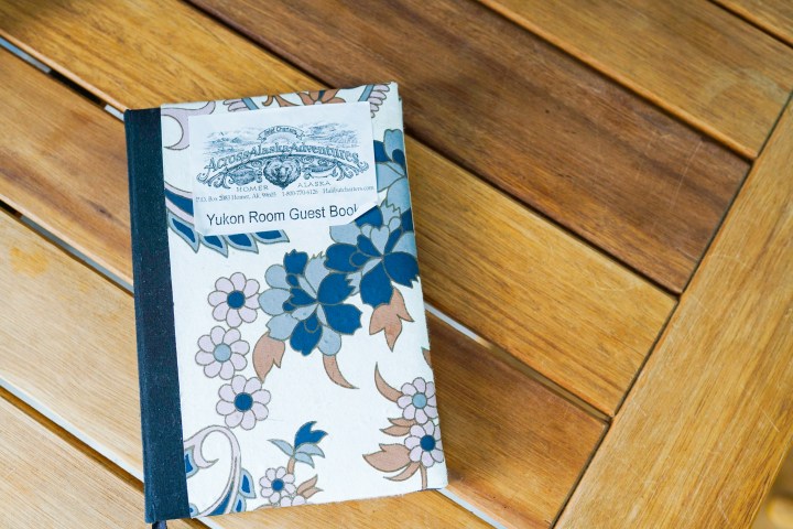 a stack of brochures on a wooden floor