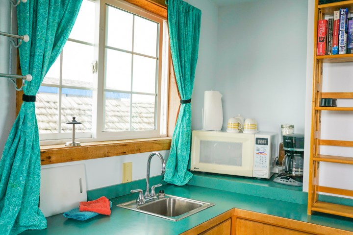 a kitchen with a sink and a window